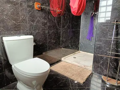 a bathroom with a toilet and a shower at Casa Miami in Tarrafal