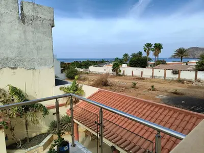 a view of the ocean from a balcony of a house at Casa Miami in Tarrafal