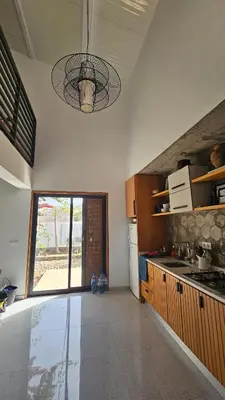 a large kitchen with a large window in a room at Serene Escape in Porto Madeira in Sacramento