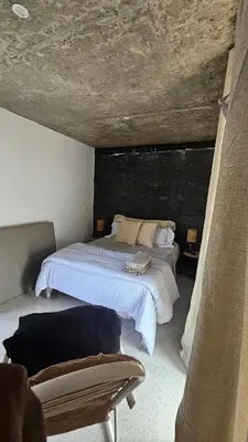 a bedroom with a bed and a couch at Serene Escape in Porto Madeira in Sacramento