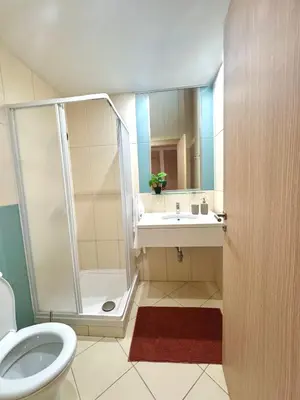 a bathroom with a shower and a sink and a toilet at BEACH HOUSE - Walkable to Beach - Wi-Fi Included in Santa Maria