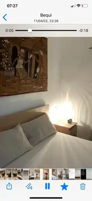 a picture of a bedroom with a bed and a picture at Casa Estoril, Boa Vista in Sal Rei