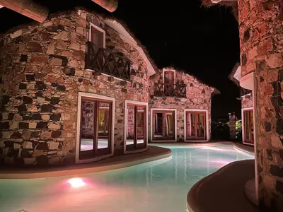 a building with a swimming pool at night at Suite and pool, Praia Estoril, Sal Rei in Sal Rei