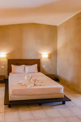 a bedroom with a bed with two towels on it at Aparthotel Tropical Bounty Beach T3 in Santa Maria