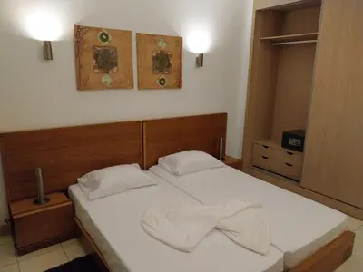 a bedroom with a white bed with two pillows at Tity Apartments T1 - Perfect Stay on your Holiday in Santa Maria