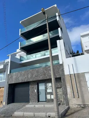 a building with a pole in front of it at Santiago Apartment in Mindelo