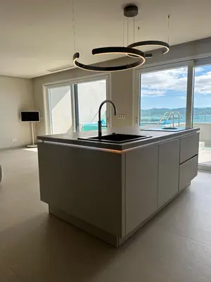 a kitchen with a sink and two faucets on it at Sal Apartment in Mindelo