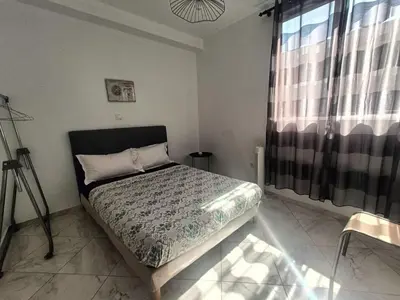 a bedroom with a bed and a window at Casa Shell in Tarrafal
