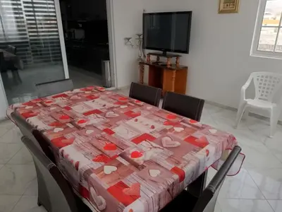 a table with a table cloth with hearts on it at Casa Shell in Tarrafal