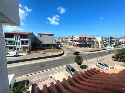 a view of a street with cars parked on the road at Casa Shell in Tarrafal