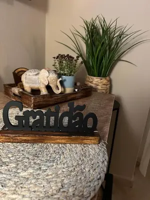 a sign that says church on a table with plants at Tropical Morna in Santa Maria