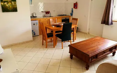 a kitchen with a wooden table and chairs at Capo Verde Club - Ca Matteo in Santa Maria