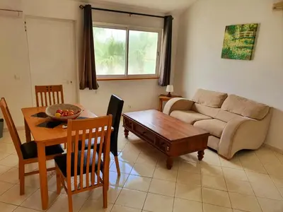 a living room with a couch and a table at Capo Verde Club - Ca Matteo in Santa Maria