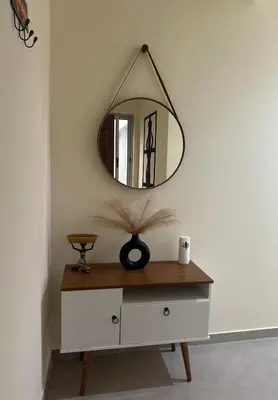a mirror on top of a dresser in a room at T1 Mindelo City Center in Mindelo