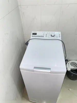 a white toilet in a bathroom with a white wall at Mar Azul Tarrafal APARTMENT in Tarrafal