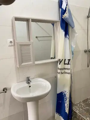 a bathroom with a sink and a mirror at Mar Azul Tarrafal APARTMENT in Tarrafal