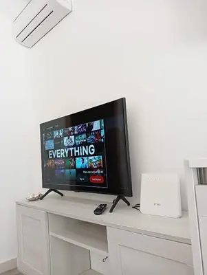 a flat screen tv sitting on top of a desk at Wave Studio in Sal Rei