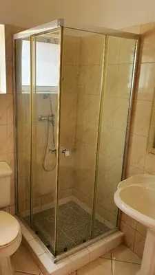 a bathroom with a shower and a toilet and a sink at Capo Verde Club - Ca Francesca in Santa Maria