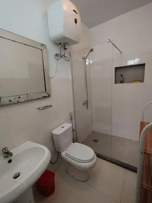 a bathroom with a toilet and a sink and a shower at Maya Mindelo 2 in Mindelo