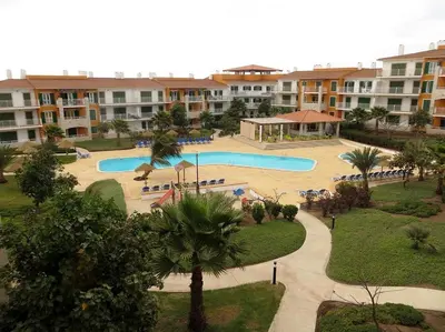 an image of a swimming pool at a resort at condomínio vila verde Pepper, Cactus T0,T1,T2 in Santa Maria