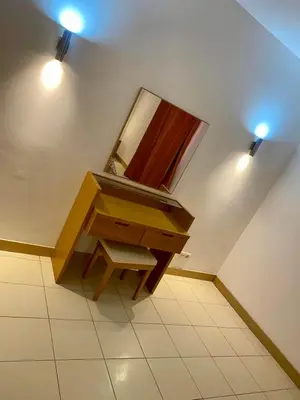 a bathroom with a wooden sink and a mirror at condomínio vila verde Pepper, Cactus T0,T1,T2 in Santa Maria