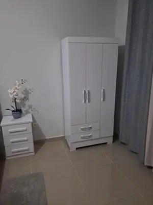 a white cabinet and a dresser in a room at T0 Cabral Next Door in Sal Rei