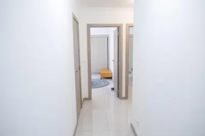 a hallway with white walls and white tile floors at Marel Bliss Apartments T2 Camila in Mindelo