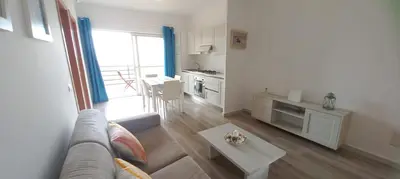 a living room with a couch and a table at Onda do Mar in Sal Rei