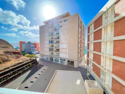a view of two tall buildings from a balcony at Marel Bliss Apartments T2 Lorena in Mindelo