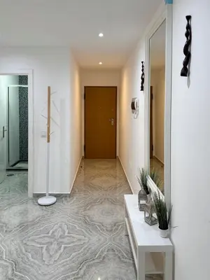 a hallway with a lobby with a door and a hallway at Spacious 3-bdr apartment - Palmarejo Grande - LCGR in Praia