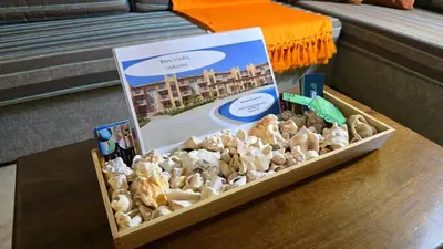 a box of mushrooms on a table with a pamphlet at T&C No Stress apartment in Santa Maria