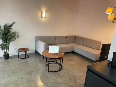 a living room with a couch and a table at Island Retreat in Santa Maria