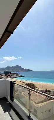 a view of the beach from the balcony of a building at Laginha Paradise II - Penthouse in Mindelo