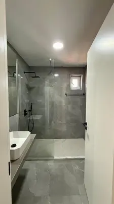 a bathroom with a shower and a sink at Laginha Paradise II - Penthouse in Mindelo
