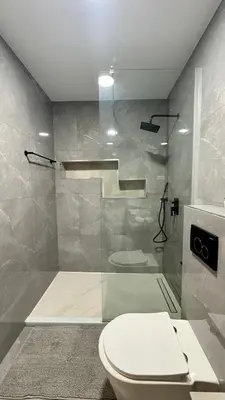 a bathroom with a toilet and a shower at Laginha Paradise III in Mindelo