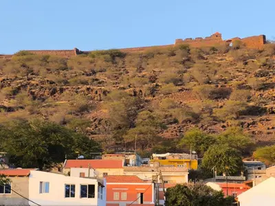 a view of a city with a hill in the background at Old Town view Apartment in Cidade Velha