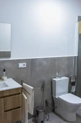 a bathroom with a toilet and a sink at Ocean View Luxury in Santa Maria