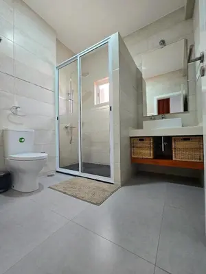 a bathroom with a shower and a toilet and a sink at Casa Bela in Mindelo