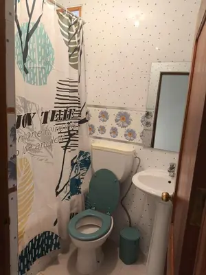 a bathroom with a green toilet and a sink at Catedral View Apartment in Cidade Velha