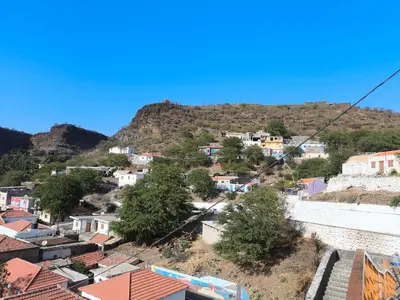 a view of a town on a hill with houses at Catedral View Apartment in Cidade Velha