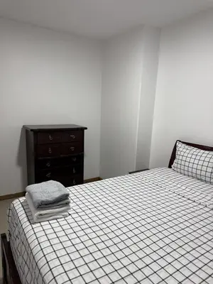 a bedroom with a bed with a dresser and a bed sidx sidx sidx sidx at Casa Cucuia in Praia