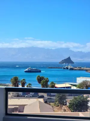 a view of the ocean with a cruise ship in the water at R3 Apartments - Laginha in Mindelo