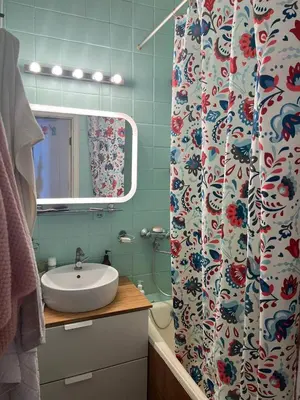 a bathroom with a sink and a shower curtain at Apt Martins May 2 in Vila do Maio