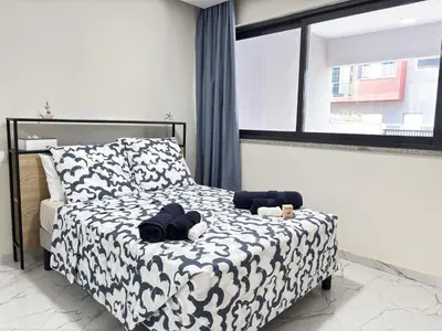 a bedroom with a bed with stuffed animals on it at Relax and Stay in Praia Spacious 3bdr Apartment in Praia