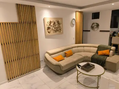a living room with a couch and a table at Apartamento Praia JOIA in Praia