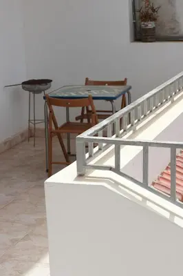 a table and chairs in a room with a table and two tables at Casa Ida 2 Tarrafal, Santiago, Cape verde in Tarrafal