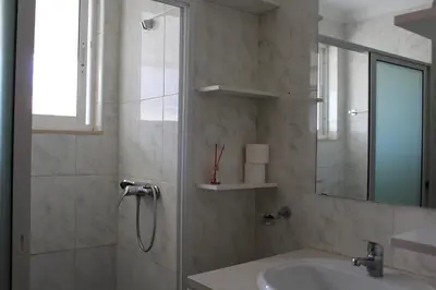 a bathroom with a shower and a sink at PR T2 TerceiroB in Praia