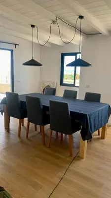 a table with chairs and a blue table cloth on it at Beautiful Penthouse in Sal Rei