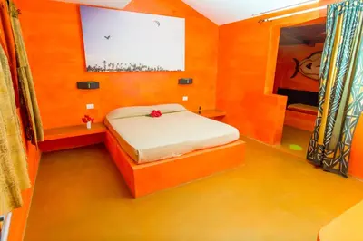 a small bedroom with a bed and a window at Surfactivity Guest House in Santa Maria