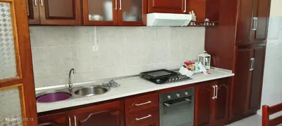 a small kitchen with a sink and a stove at Residencial Soares in Espargos